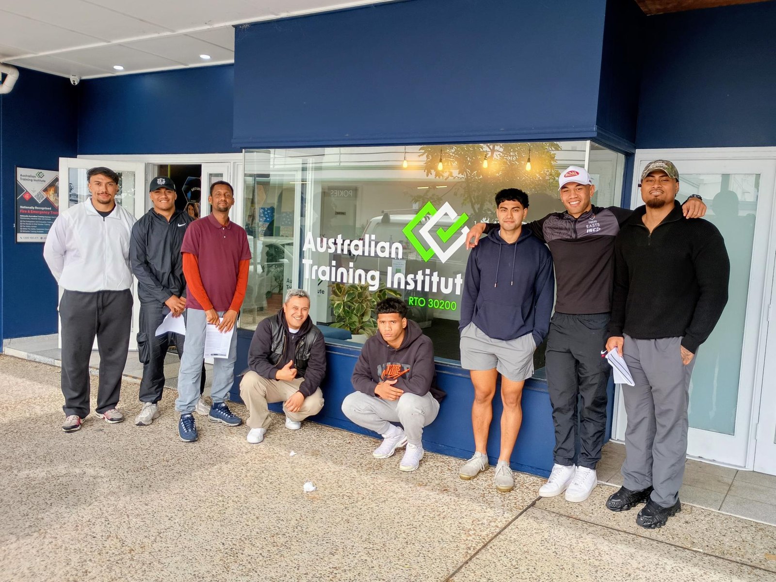 ATI students and team outside the Australian Training Institute storefront.